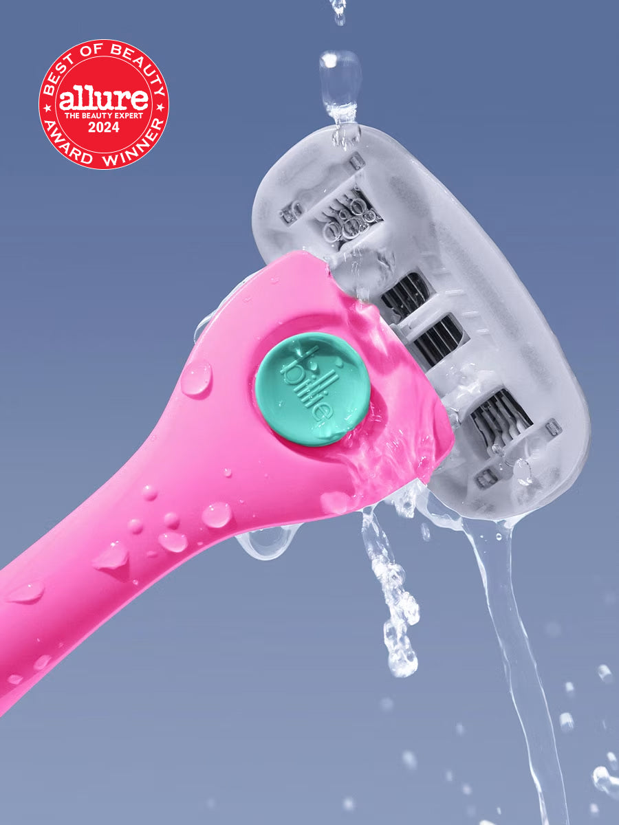 Pink "billie" razor with turquoise button under running water, set against blue background with Allure 2024 award badge.