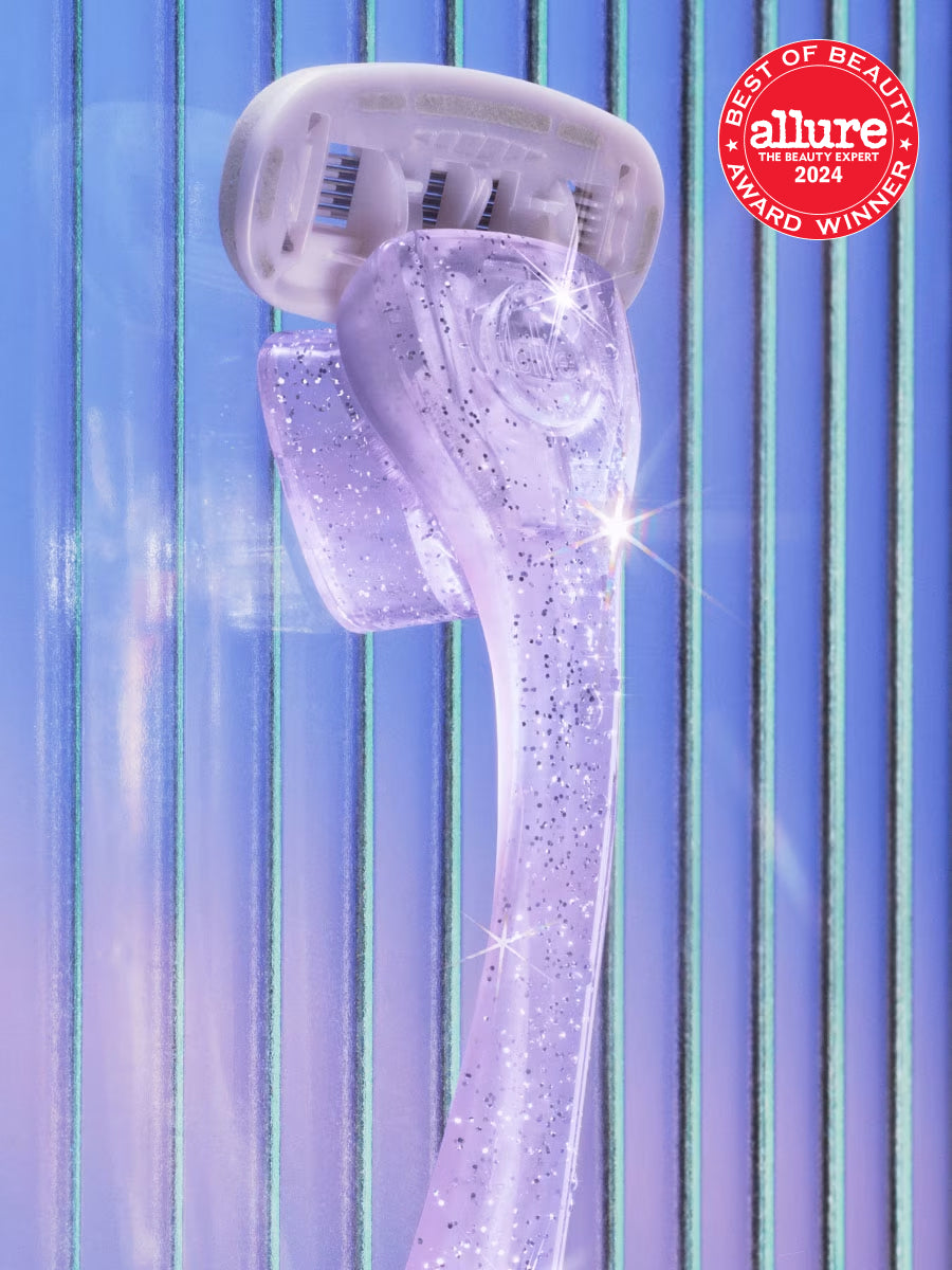 Sparkling purple razor stands upright on blue-striped background, featuring Allure’s 2024 Best of Beauty badge.