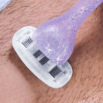 A purple shaver glides over a hairy surface, removing hair and leaving a smooth path, in a close-up view of shaving.