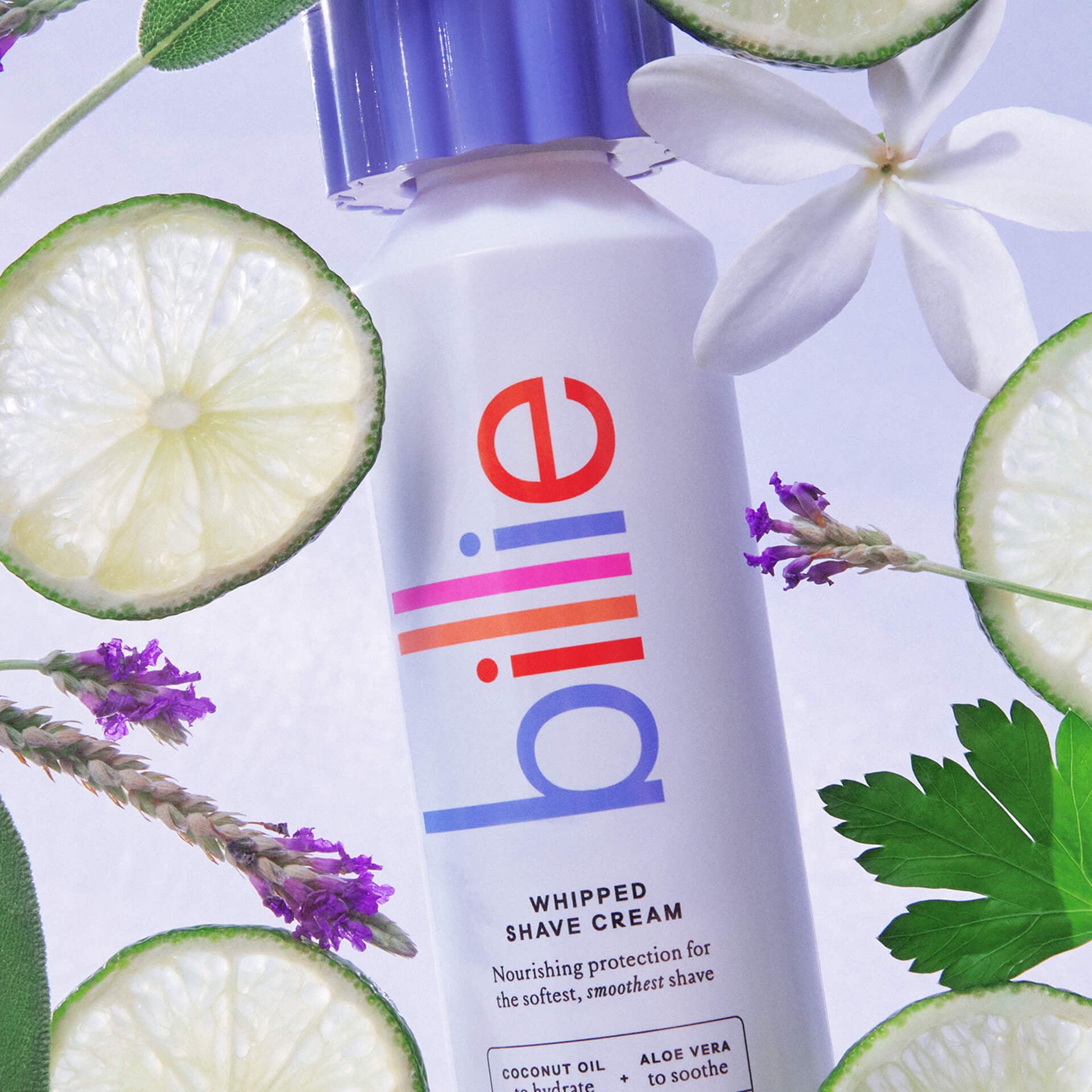 A "billie" whipped shave cream can with text: “Nourishing protection…” surrounded by limes, flowers, and lavender.