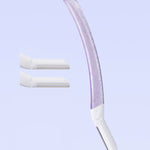 Curved purple Billie razor with translucent handle and two white blade refills on soft blue background.